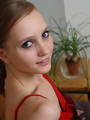 Teen takes off her red dress and masturbates